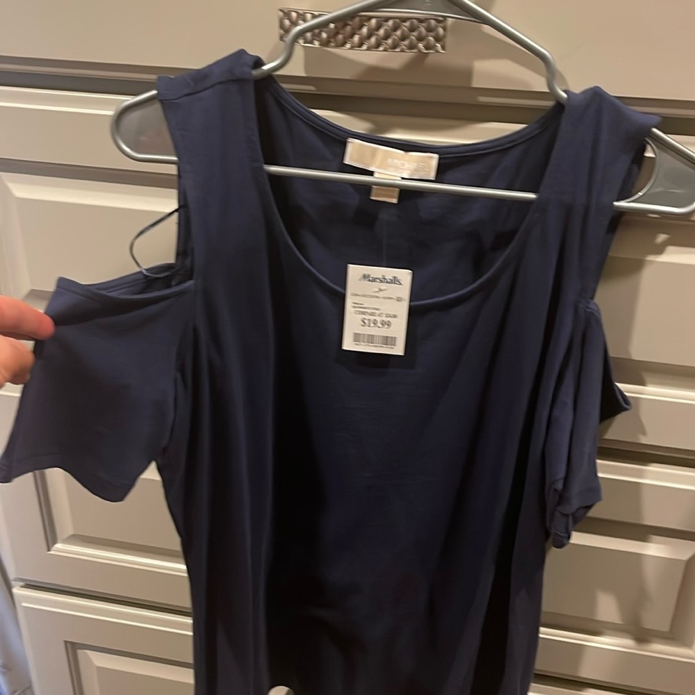 Michael Kors t-shirt. Never worn, has sleeve cut outs.